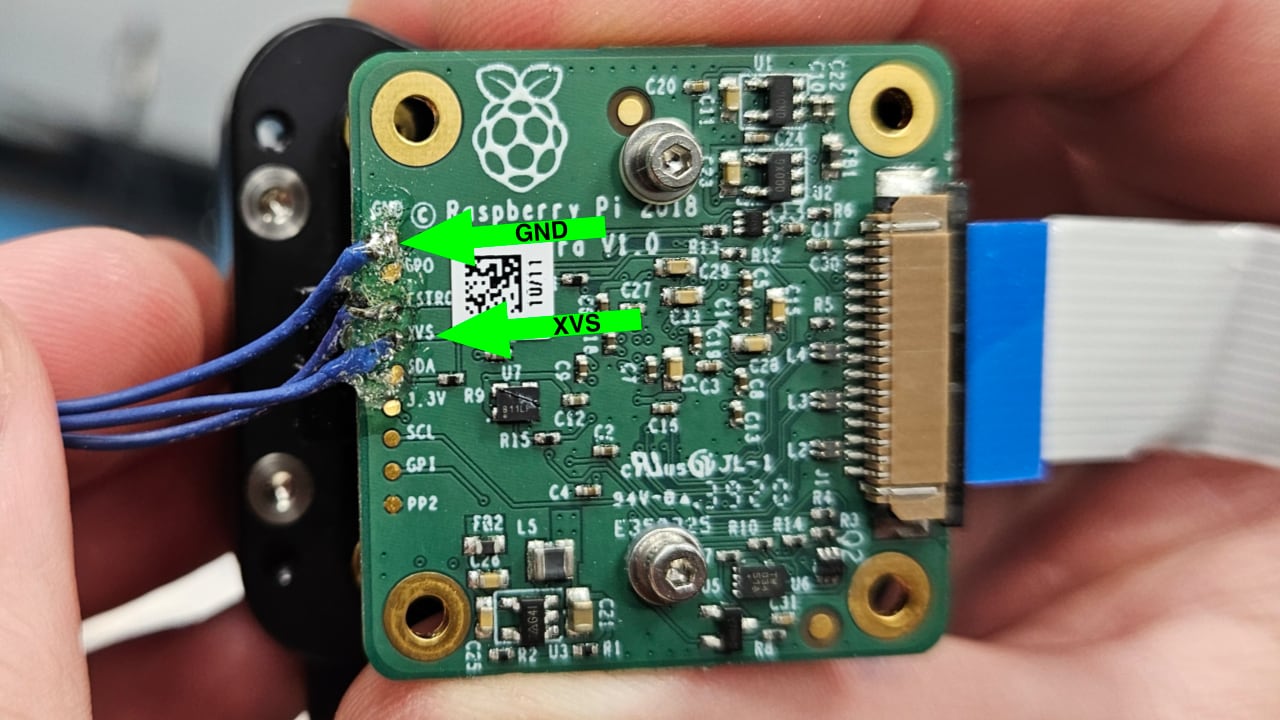 Location of the XVS and GND pads on the official Raspberry Pi HQ camera module
